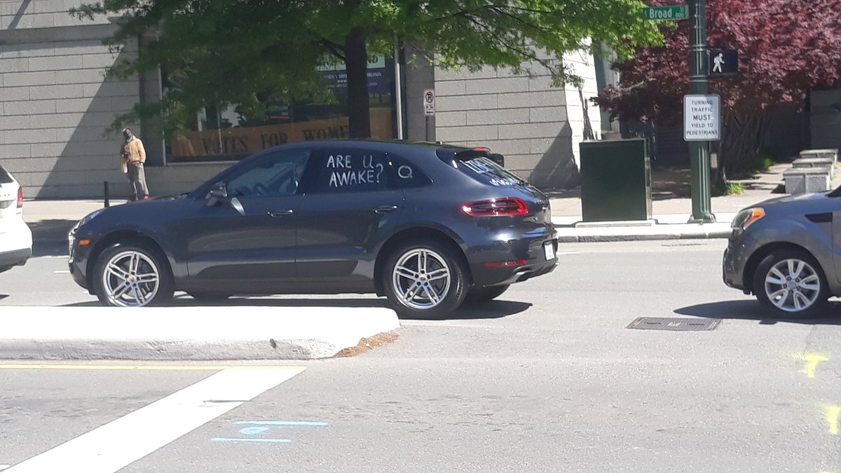 Pair of cars with Qanon references