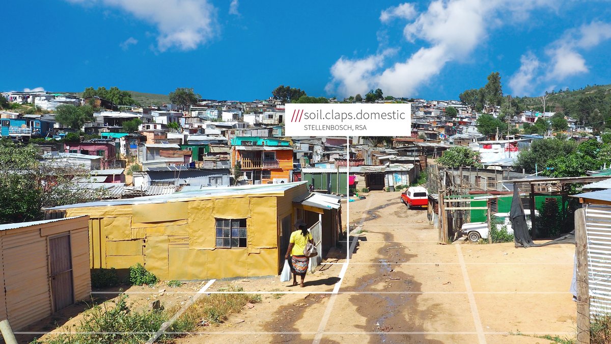 Township in Stellebosch, South Africa. what3words address reads ///soil.claps.domestic