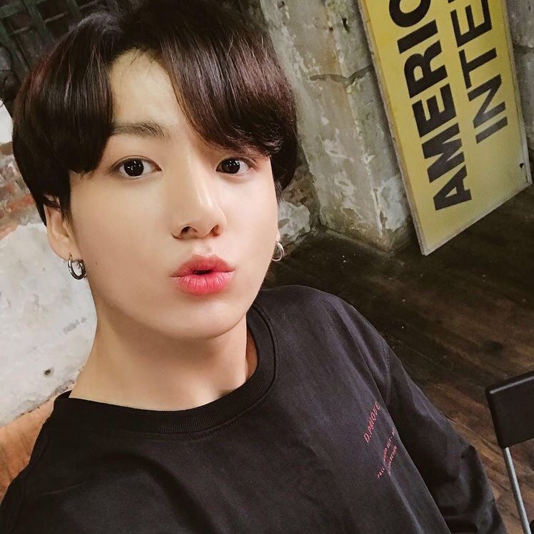 jungkook with comma hairstyle; a thread