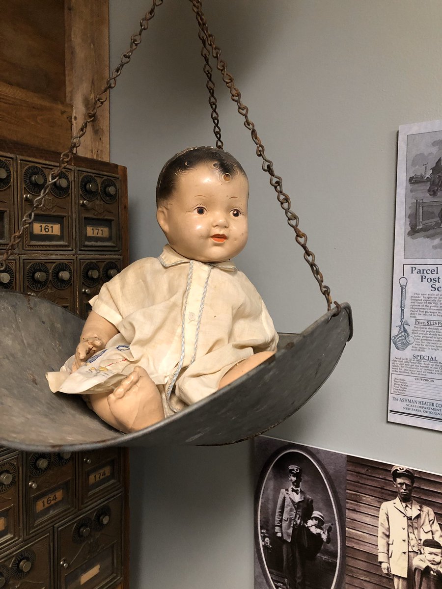 dcahc_museum's tweet photo. #CreepiestObject #CURATORBATTLE 

The baby doll in the Post Office. 
A few years ago, Claire found it on the floor beneath the scale although no one had been in that room to mess with the exhibit. 😳 https://t.co/q8VB8NGEUm