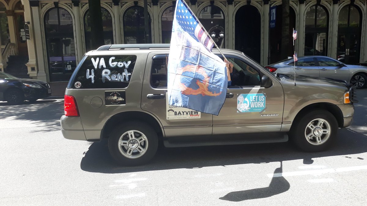 I apologize, earlier I said this vehicle with the Q anon flag had an amanda chase magnet, it is instead a magent for real estate agent