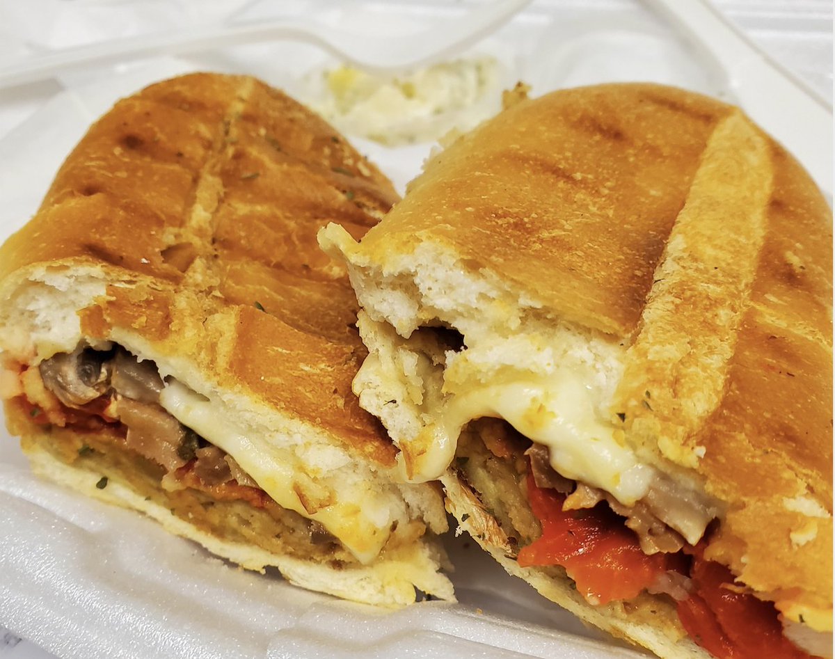 AndiMarchal's tweet photo. My wonderful boss bought 'The crazy 10' as we call ourselves, (the 'essential' (hogwash) staff left), lunch today. Made the day a bit better. Vegetable panini with peppers, eggplant and mozzarella.
#CovidCoping
#WorkatWork
#essentialbusiness https://t.co/e9KfoVKHlI