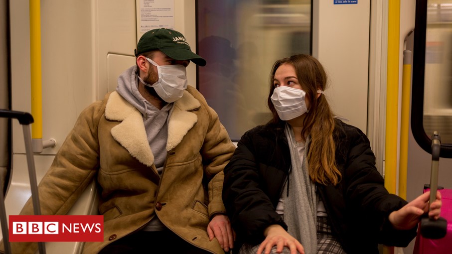 People on public transport wearing face masks