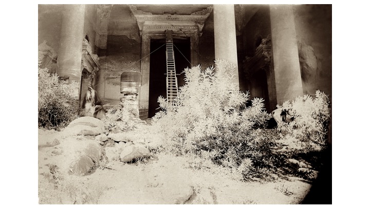 The Khazneh is a rock-cut tomb, probably for Nabatean king Aretas III (84 - 56 BC). In 1910, Mackenzie & Newton joined Gustav Dalman in making the 1st detailed architectural study for the  @PalExFund. A more recent photo shows the fallen column restored to its original position.