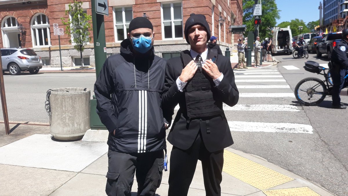 one guy with a mask, one guy with a vest