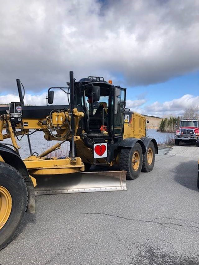 NS_PublicWorks's tweet photo. One of our colleagues lost both his parents in last weekend's tragedy. Cory, all your friends and colleagues at TIR, as well as every Nova Scotian, are with you. A yellow truck convoy drove by Cory’s home today to show support for Cory, and his mum and dad, Joy and Peter Bond. https://t.co/EuLkr39mdx