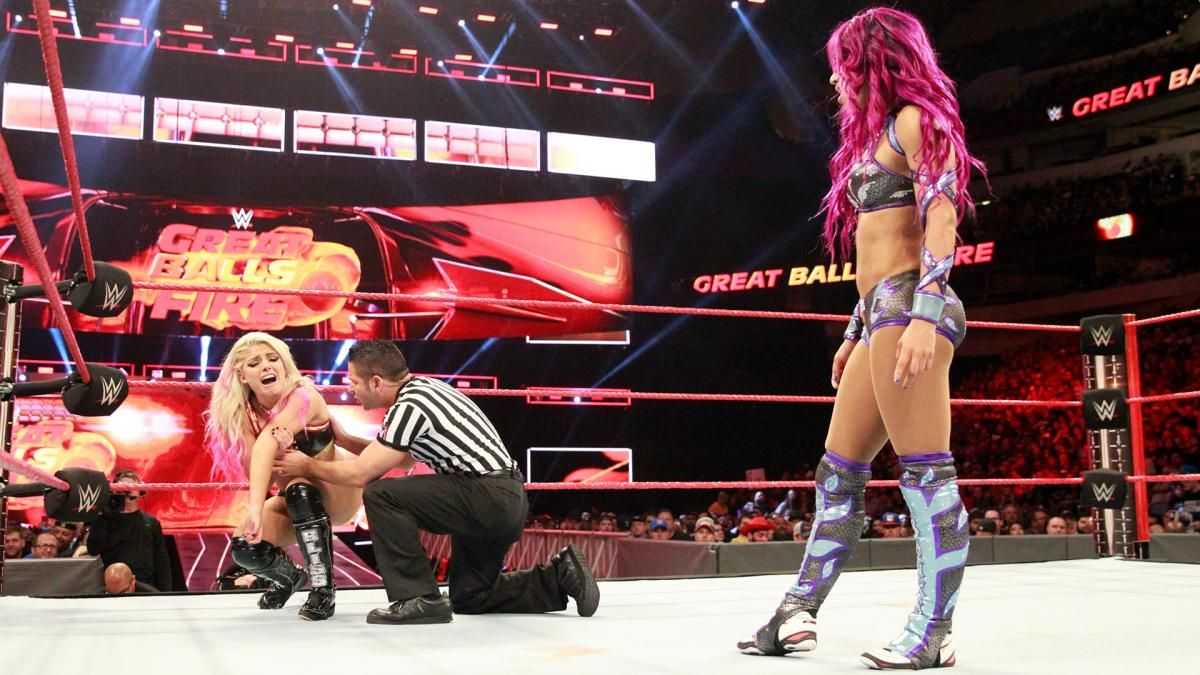Alexa is acting like her arm is injured & Sasha is acting like she is falling for it. 