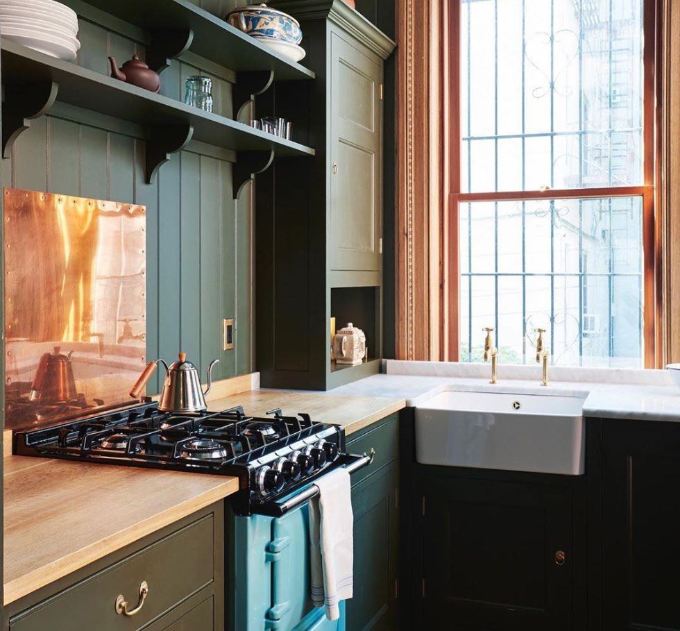 AGA and #plainenglish imbue #British pedigree into this stylish #NewYork #kitchen. A delightfully bold AGA nests among deep green and #copper accents with surprising harmony. Shown: AGA City24 Dual Fuel Range in pistachio. 
#interiordesign