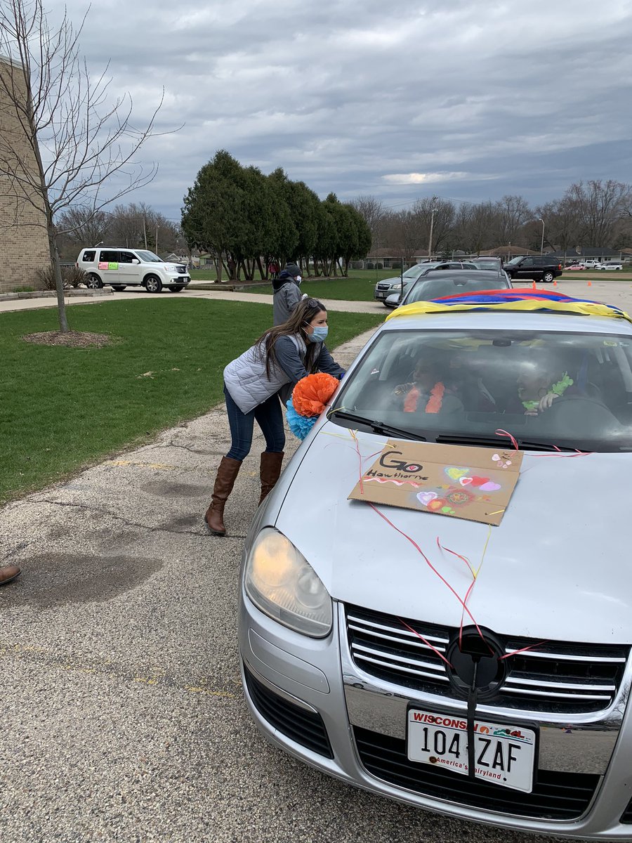 omasism's tweet photo. Hawthorne car parade!  What a great turnout.  So great to see all of the Hawthorne community; staff, students and families with smiles on their faces. Everyone was excited to see our dedicated principal handing out sandwiches!  Thank you Pewaukee Chick-fil-A for your partnership! https://t.co/wJKZH8pJgm