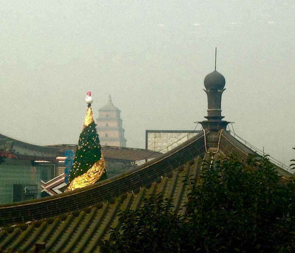 China pic, day 6:A giant Christmas Tree and the Xi'an Wild Goose Pagoda, December 2015. Took this from a restaurant during a boozy baijiu brunch celebrating the birth of my frisbee teammate's kid.