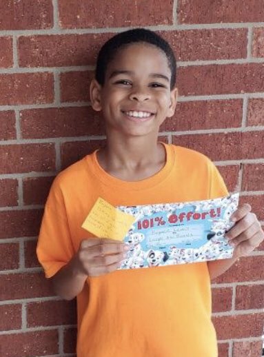 My student is all smiles for receiving his certificate for outstanding Zoom participation in the mail. 
#jeschat