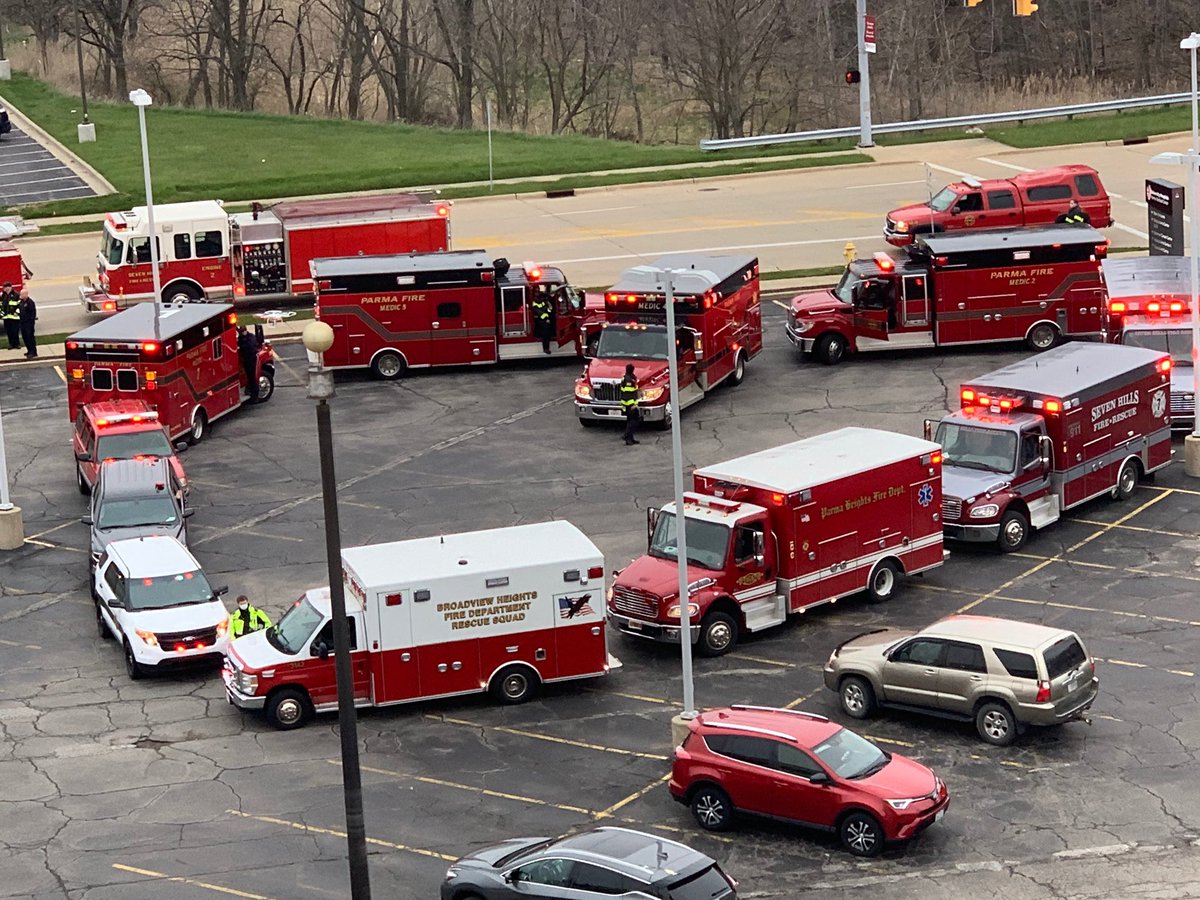 ParmaMayor's tweet photo. When six fire departments arrived unexpectedly at UH Parma Medical Center this evening, they weren’t bringing patients. Instead, they were bringing their love. In fact, they parked vehicles in the shape of a heart to show frontline health car￼e workers they are appreciated. https://t.co/vsj4XPsTLm