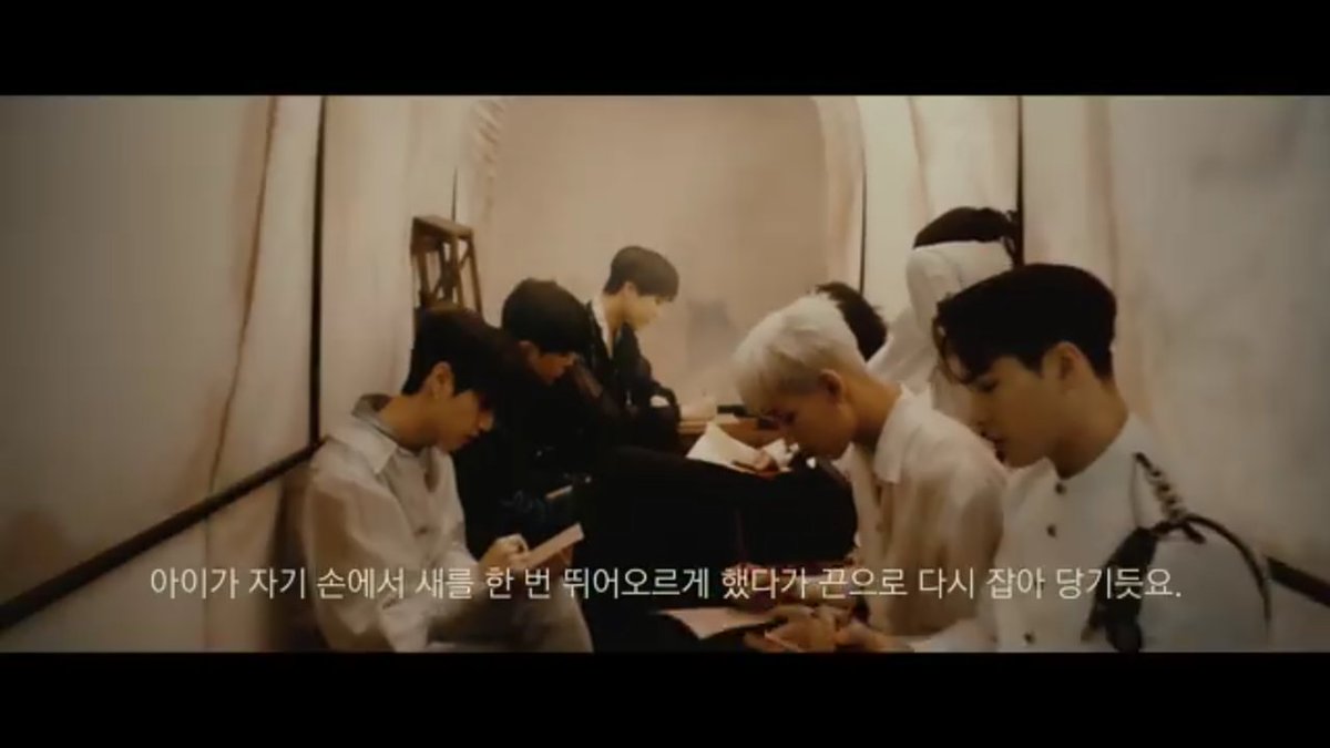 <DYE> Cinema Trailer:Juliet is narrating the original R&J act.At the end, the boys are inside a wagon writing something. They were headed to a performing stage tent as if they're gonna perform an act.Their outfits here is what they were wearing on their solo shots on the MV