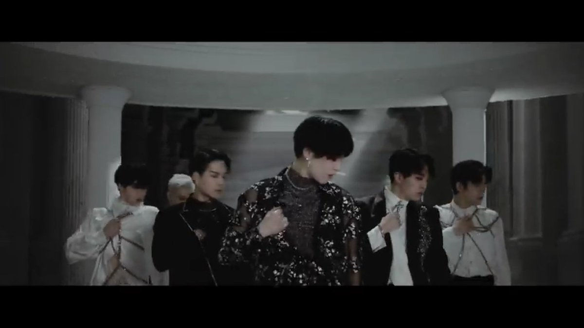 GOT7 walking to the half-opened casket, surrounded by men on black robeYugyeom holding a birdJB dropping the poisonA man in black robe pouring something on the casket (probably to wake Juliet up) @GOT7Official  #GOT7   (sleeping beauty ang peg )
