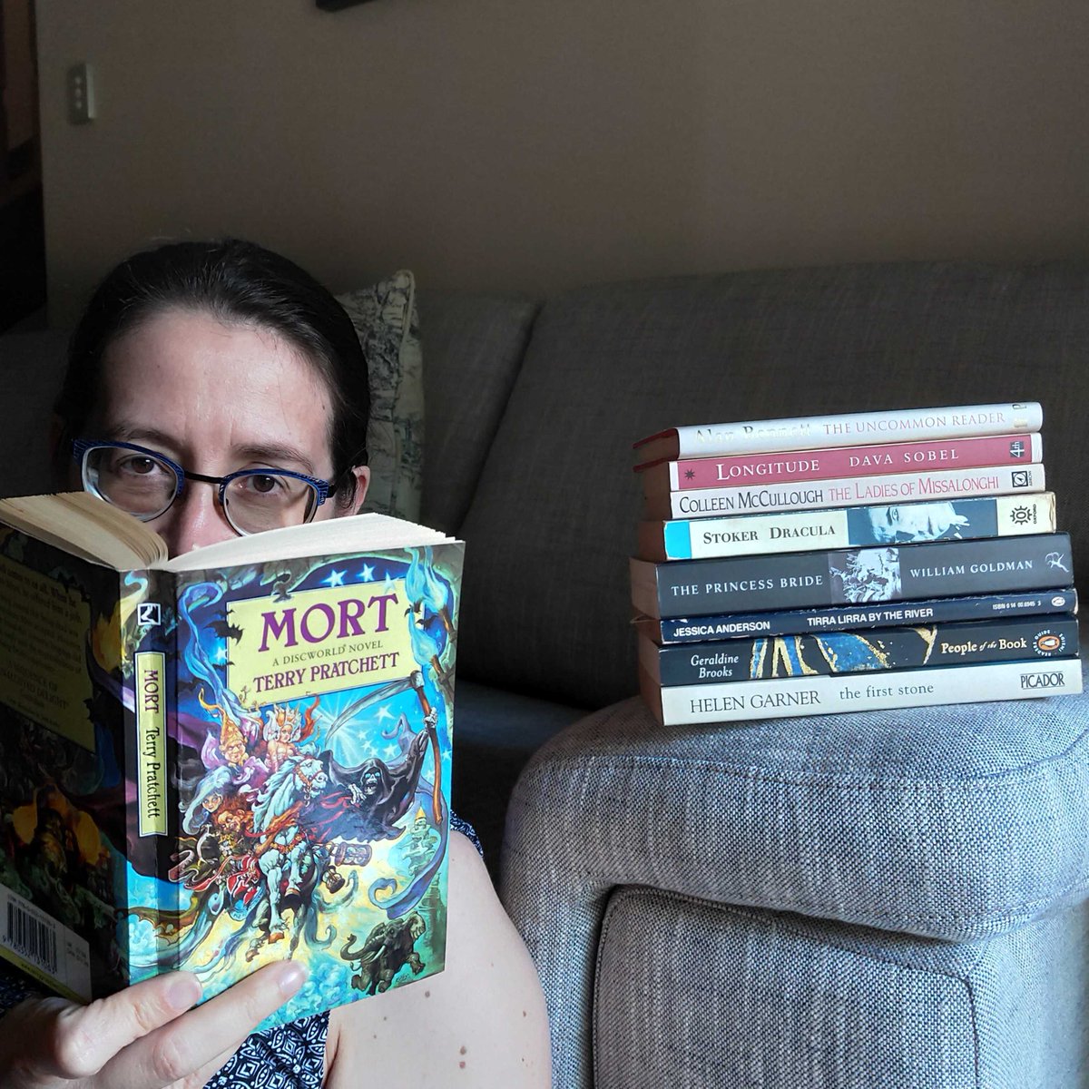 Another stack of books and a pair of glasses (people are going to stereotype us!) Project manager Penny has a mix of genres in her pile: have you read any?  #WorldBookDay 7/