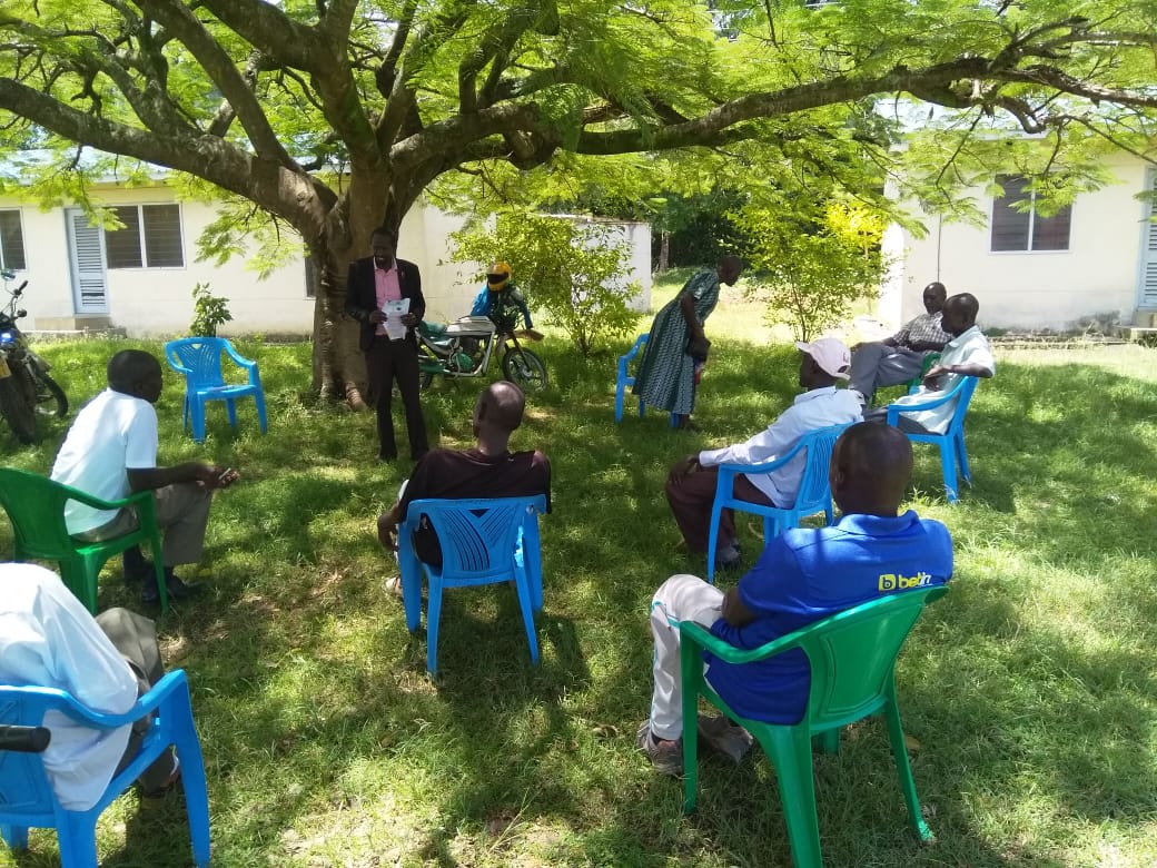 Facilitating a session on Covid 19 to community level resourcepersons, Village elders in Seme sub county.