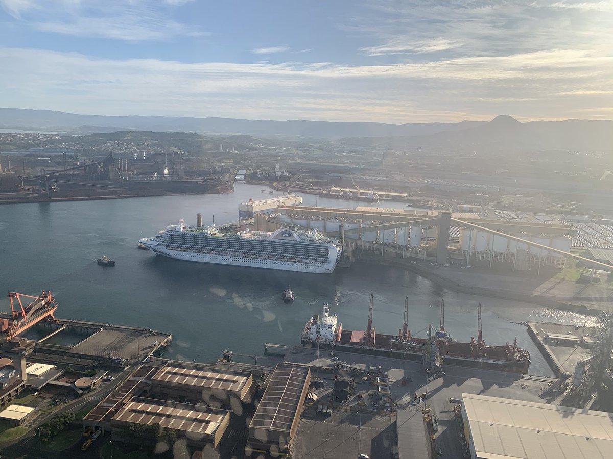 The tugs have come out as the Ruby Princess prepares to leave Port Kembla