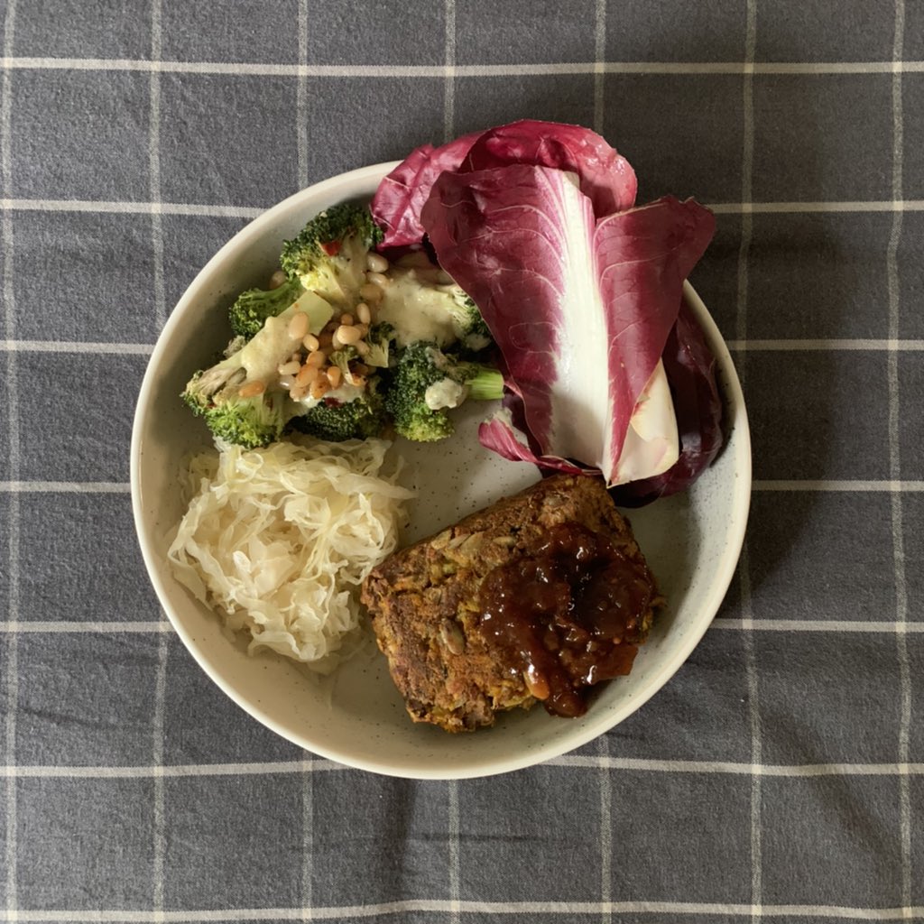 this is a late lunch: nut loaf w chutney, salad, kraut n some brocc with tahini