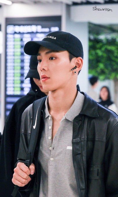 shownu wearing a cap/headwear; a thread