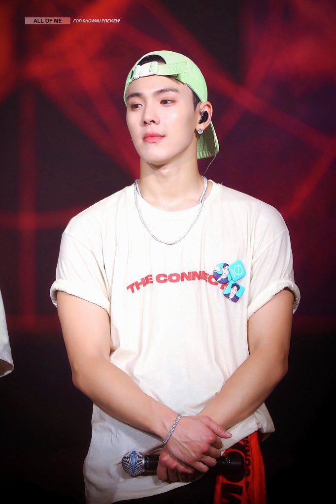 shownu wearing a cap/headwear; a thread