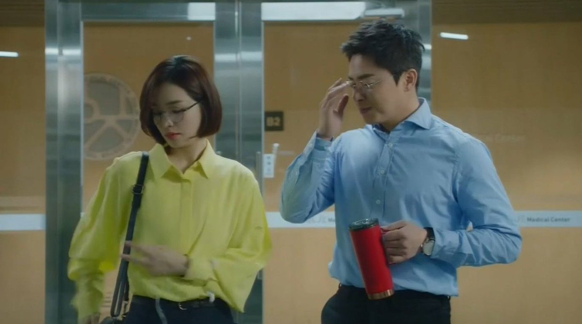 the red flask. songhwa gave it to ikjunikjun took itbut seokhyeong came to interrupt them so he gave it back to songhwa againthat was smooth, pdnim.  #HospitalPlaylist