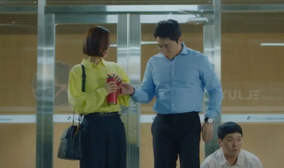 the red flask. songhwa gave it to ikjunikjun took itbut seokhyeong came to interrupt them so he gave it back to songhwa againthat was smooth, pdnim.  #HospitalPlaylist