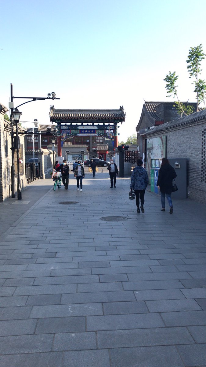 ...on the left still has barriers that require customers to order from the door. The good news is that the local liquor shop (left) is finally allowing customers into the shop. Meanwhile Nanluoguxiang (right), normally the most crowded street in Beijing because of all the...