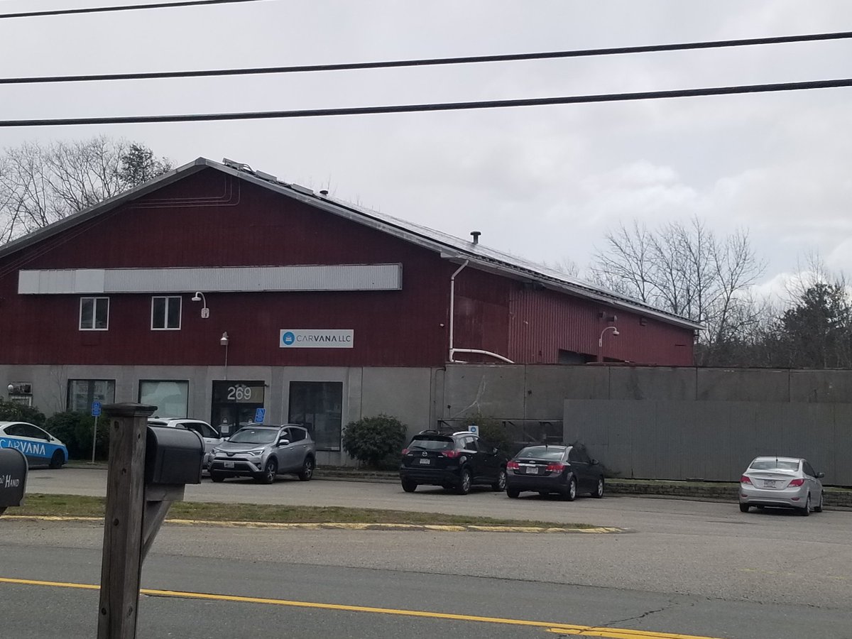 Carvana, a thread. I had a stupid looking tow truck in front of me yesterday.i noticed it pulled into this building. This is bad even by used car standards.