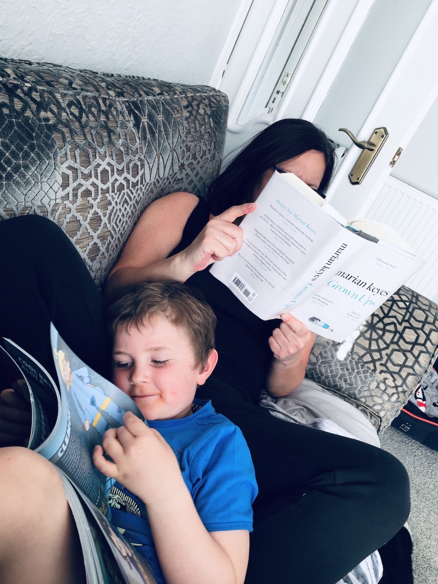 Sam and Ethan like having a cuddle together on the couch while they take some time out to read. Sam has found the perfect book to relax with, 'Grown Ups' by  @MarianKeyes  #ReadingHour  #WorldBookNight