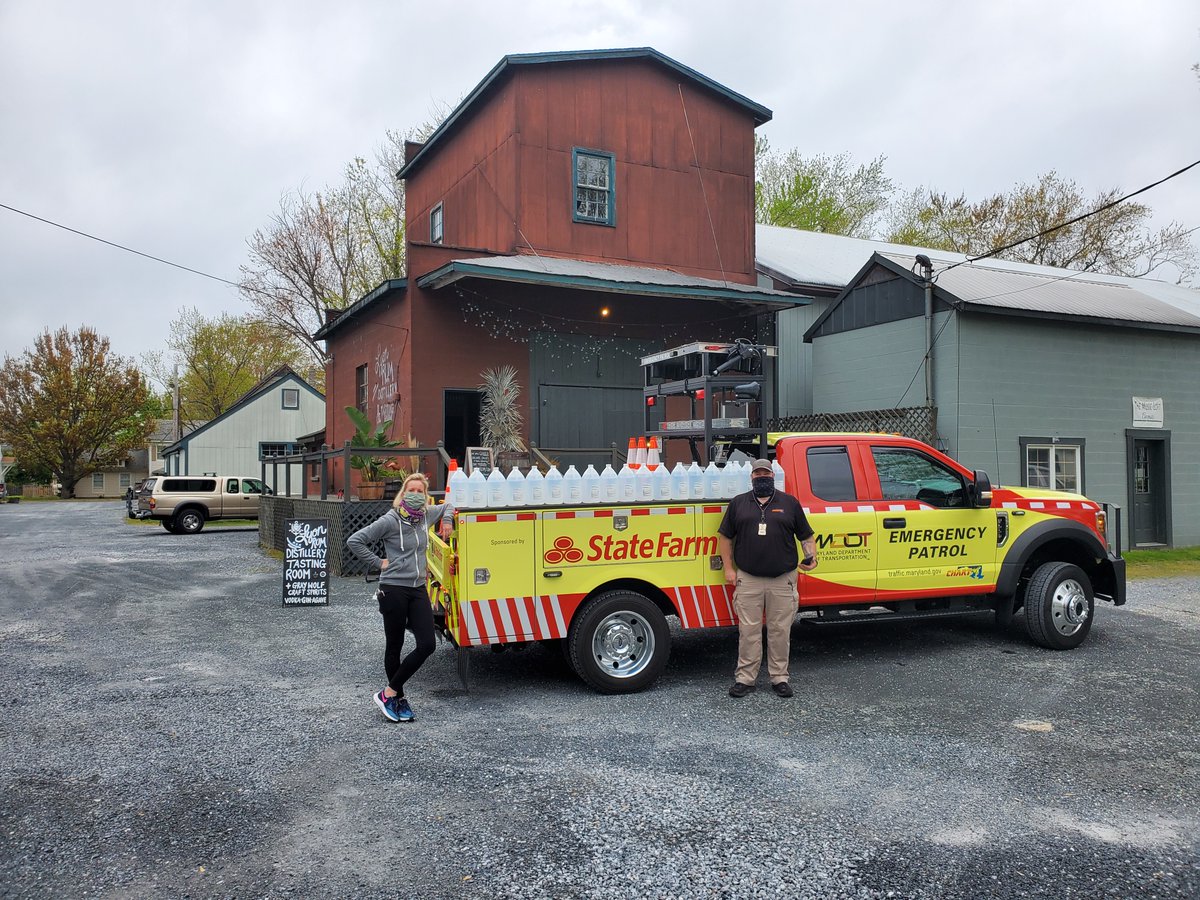 MDSHA's tweet photo. A big thank you to @LYONRUM &amp; Distillery for making us 20 gallons of hand sanitizer for the folks at our Office of Transportation Mobility and Operations who monitor and respond to crashes. Pictured here is owner Jaime Windon and our own Tim Peck. #COVID19 #FrontlineMDOTforYou https://t.co/Mq3C9BlyMb