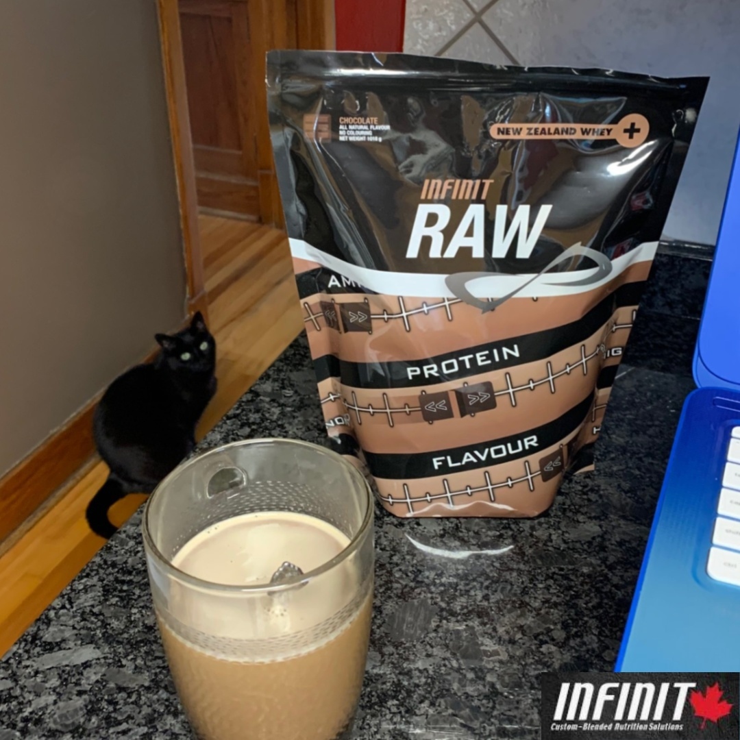 grupponutrition's tweet photo. My Infinit home office. Getting some work done while boosting my afternoon coffee with 20 g of chocolatey protein. - ☕️😋👌
#infinitfuelsme #staysafestayhome #proteincoffee #mochalatte #blackcat https://t.co/UnL7s0u5jU