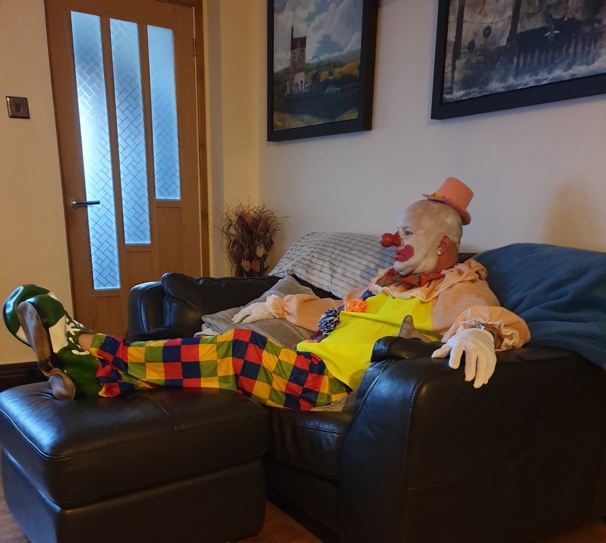 DebbieCowen's tweet photo. My hubby dressed up for the 8pm street clapping...he now thinks its normal to sit in it to watch tv ...#ClapForTheNHS #ClapForCarers #clapforkeyworkers #madasahatter 😂😂 https://t.co/QDfdDYHaSP
