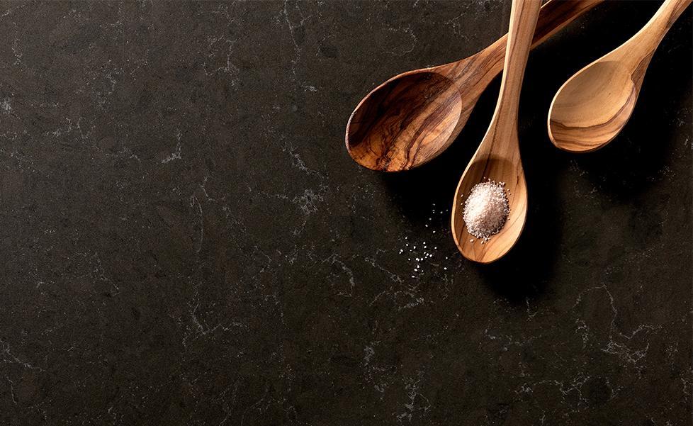 Wilsonart's tweet photo. Design Spotlight:  
▪️ Featured Design: #WilsonartQuartz Hanola Grey 
▫️ Hanola Grey is a two-toned dark grey quartz design with undertones of brown. Scattered throughout the design are wispy white veins.

Click the link to see all the details https://t.co/iZ9xNFgfJE https://t.co/emP1UpVVnP