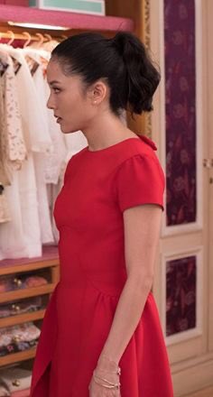 Rachel Wu in the red dress. The character is rightly called out for putting on a red dress bc it’s an American’s idea of what Chinese would think is lucky, but more importantly, the dress doesn’t fit. It’s the wrong proportions on her. Symbolizes how Rachel doesn’t fit.