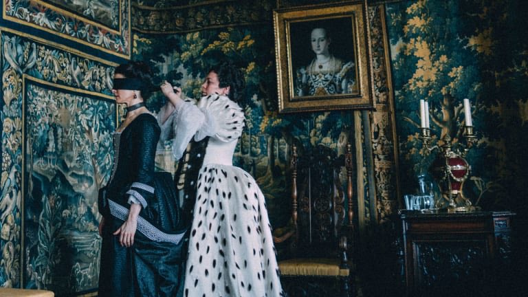 One of my recent favorites is The Favourite. Sandy Powell is a freaking genius. The closer women are to the power and favour of the Queen, the more intricate, and graphic black and white their clothing. The men are fops in their unserious pastel colors  https://www.variety.com/2019/artisans/awards/the-favourite-mary-poppins-returns-contenders-artisans-costumes-xyzz-1203138014/