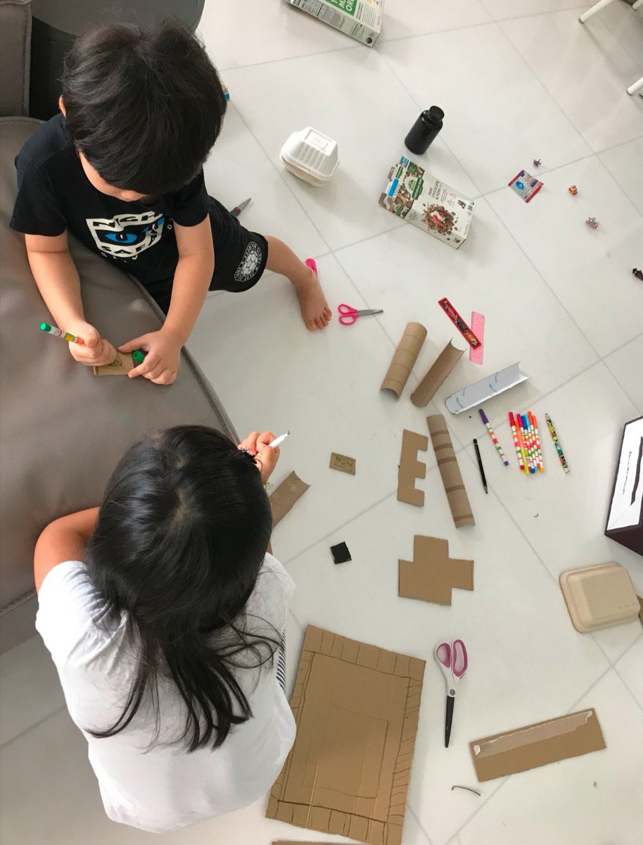 Turning trash into easel, princess robot, mud kitchen and board game! #reusingmaterials #isklproud