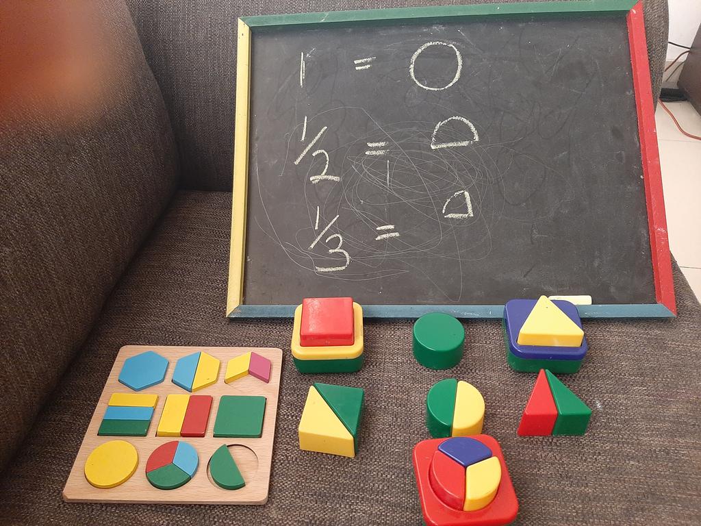 Day 34  #lockdownextension it's time for Fractions and bebe is killing it!Reinforcing the concepts with our puzzles toys. Whiteboards markers tend to be hit-and-miss (half are dry, don't write well), so we went old school (they love the mess). #lagoslockdown  #lagos