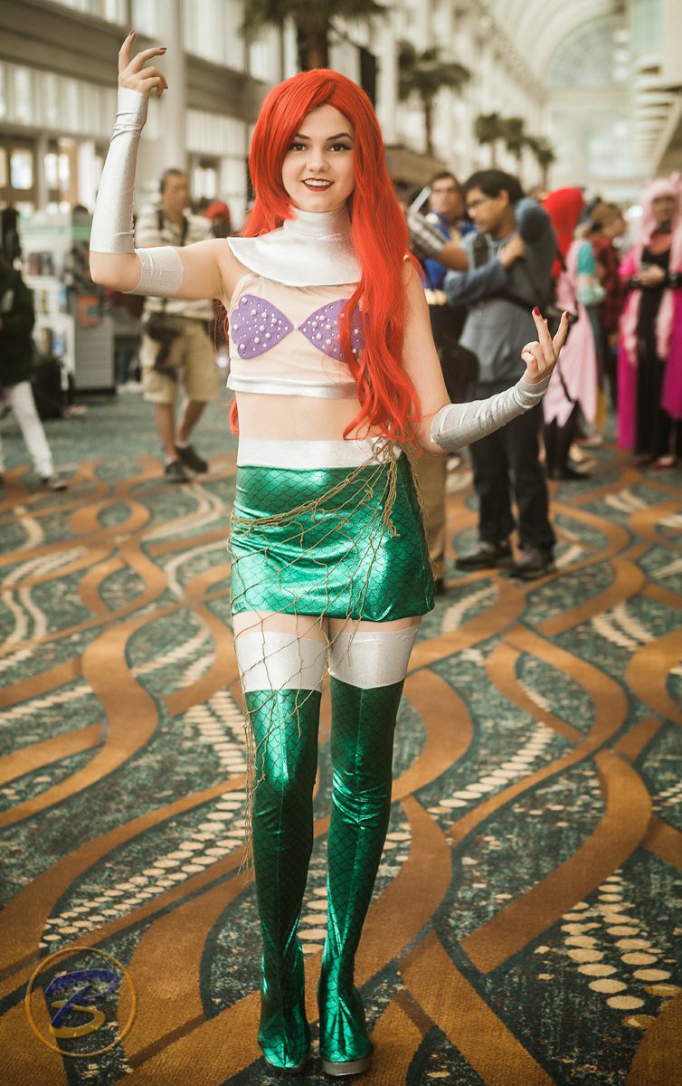 Starfire/Ariel. (I get ideas in my head sometimes and have to run with them) This is the first costume I ever made from scratch. Couldn’t find a mermaid fabric so I hand drew every single scale onto metallic spandex