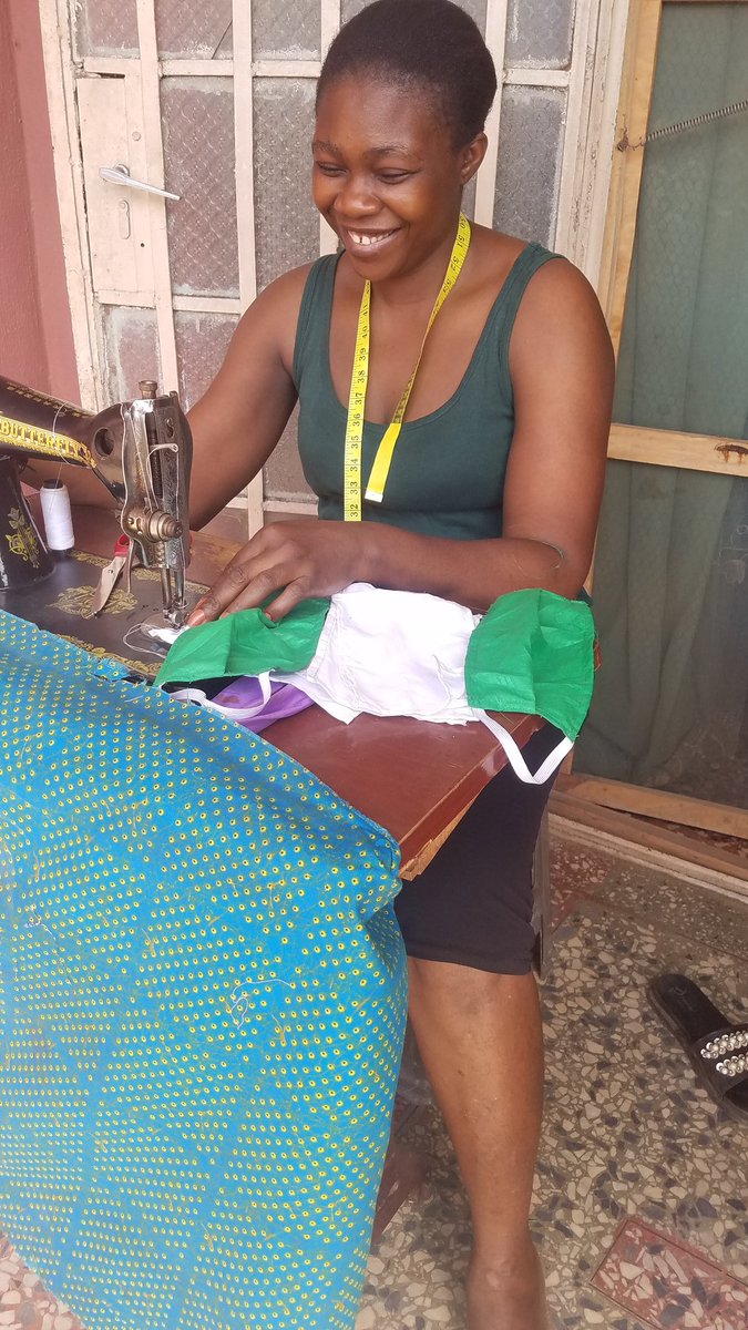 Heartisan9ja's tweet photo. A Patriotic Cloth designer happily making Mask in the National Colors, for free distribution to friends and Families.
#mask4all9ja 
#Mask4allChallenge 
#maskchallenge https://t.co/weuk2UxaX6