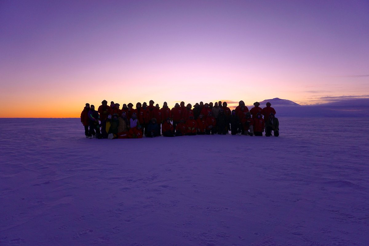 AntarcticReport's tweet photo. Goodbye Sun, hello starry nights! McMurdo winter-overs gather for a last sunset party out at Phoenix Airfield on the Ross Ice Shelf. This view north at 2pm; the Sun scraped the horizon for 40 minutes, then disappeared - for what will be almost four months; pic Lauren Chastang https://t.co/O2bshhYfaS
