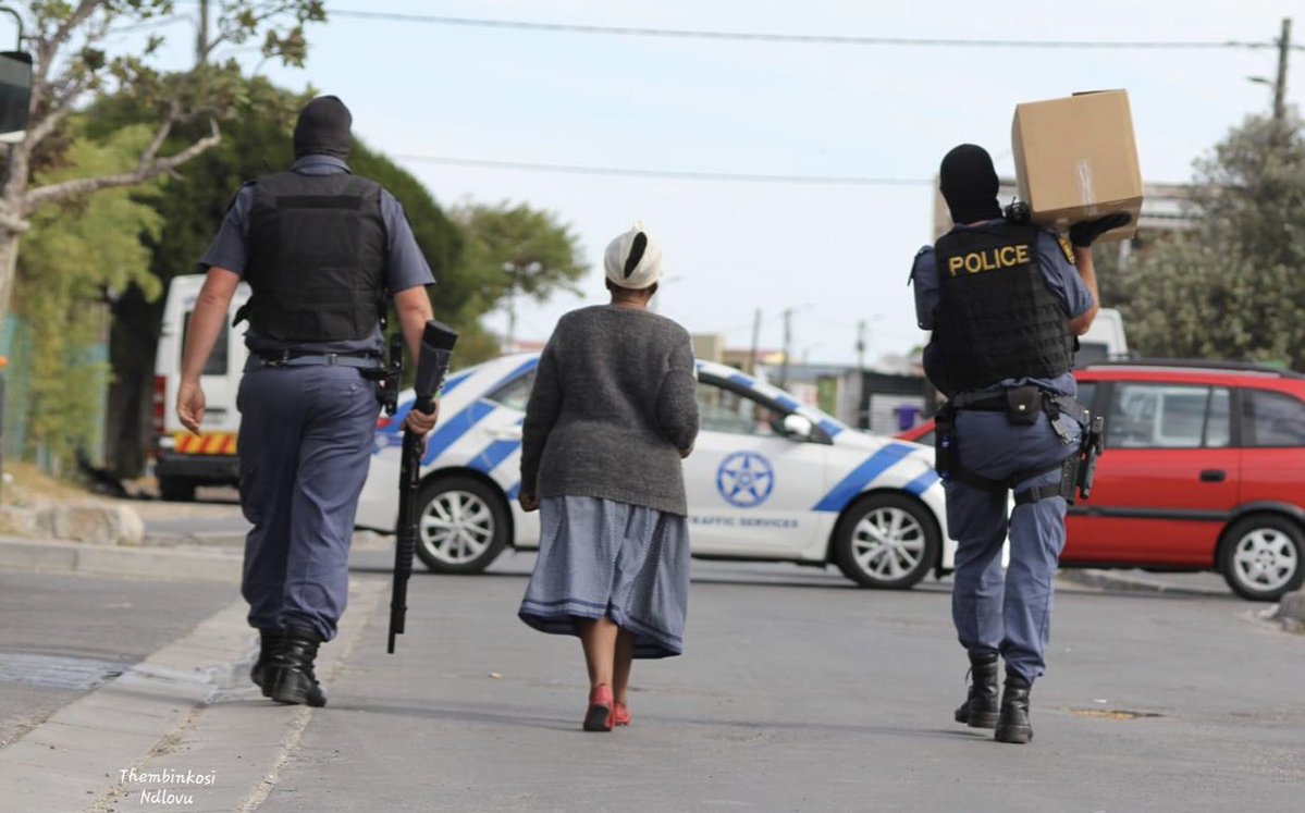 The senior citizen has not been arrested... The cops are helping her by carrying the  food package. Images like these fill us with joy. Good to see some law enforcement officers showing the true spirit of Ubuntu. <a href="/SAPoliceService/">SA Police Service 🇿🇦</a> <a href="/GovernmentZA/">South African Government</a>