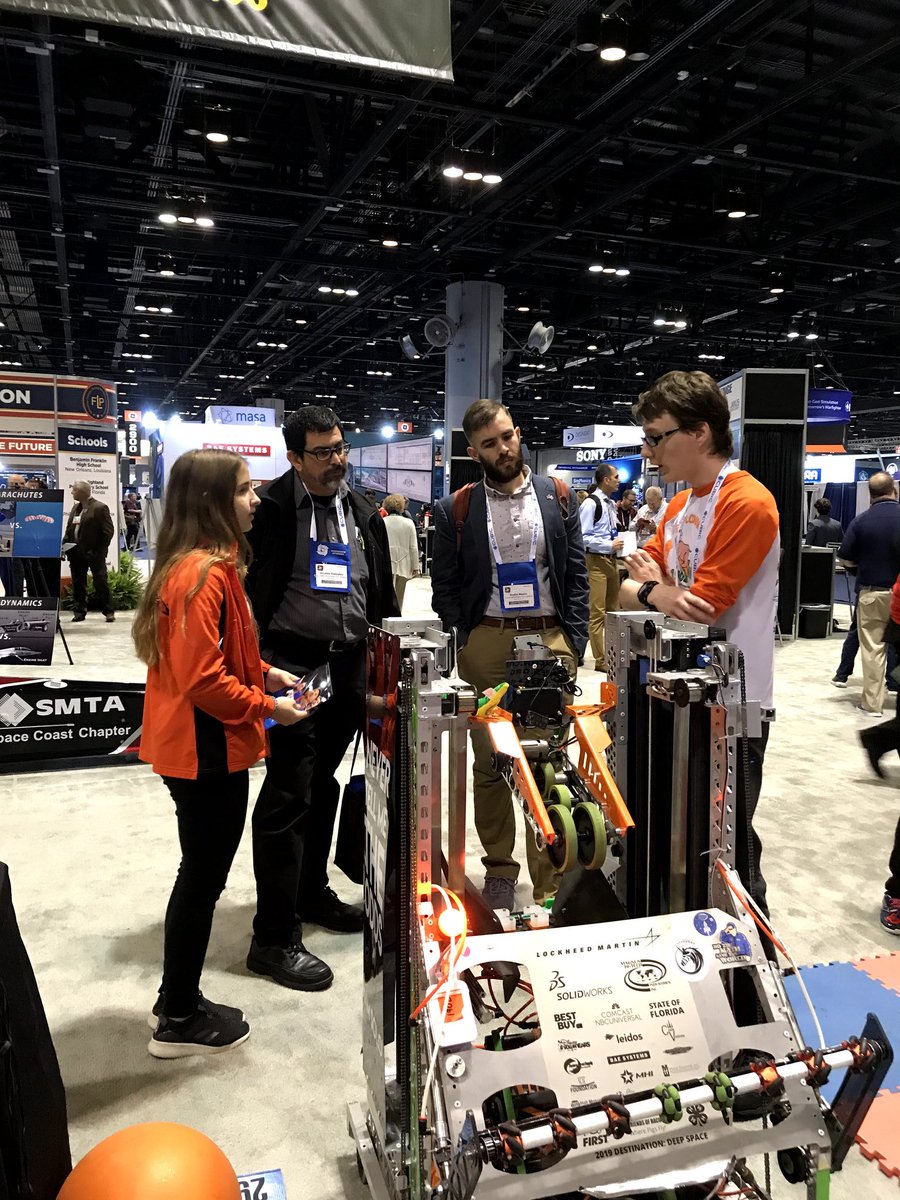 FRCBacon1902's tweet photo. Day 5 of #12DaysofOutreach - 
At I/ITSEC we speak to modeling, simulation &amp; training professionals about @FIRSTweets. Getting a chance to speak to industry leaders about how the skills we are learning can be translated into future careers is a highlight of the conference. https://t.co/TirdMFPNEE