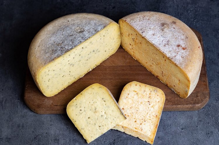 Add some flavor to your life! Our Garlic and Herb and Red Pepper cheeses are back in stock online