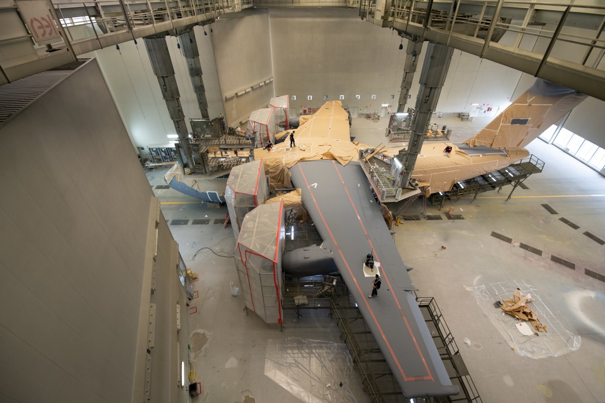 AirbusDefence's tweet photo. Once assembled, the first of a total of 7️⃣ #A400M for @BeAirForce 🇧🇪 enters the paint shop and starts going grey! 
Follow the painting process here 👇
Stay tuned…😉 https://t.co/wi2SmsWCDR