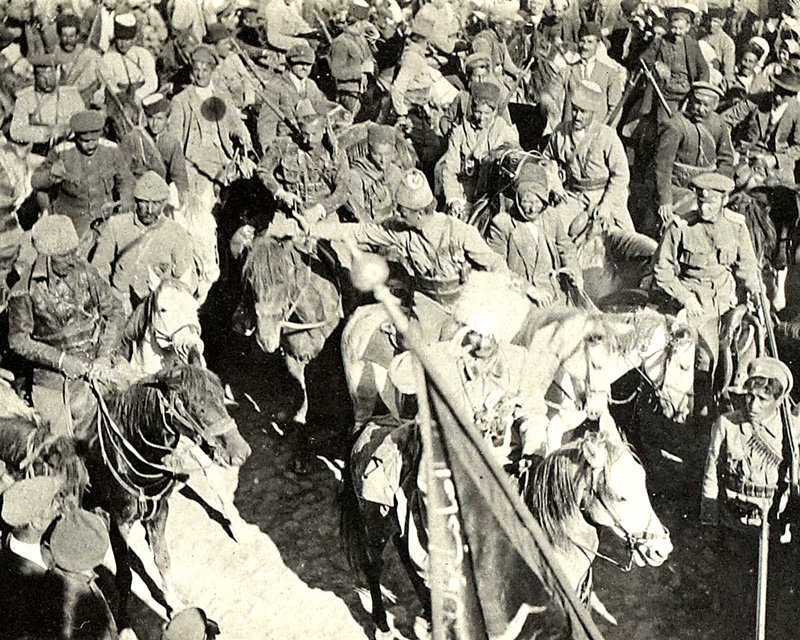 JessiArabou's tweet photo. Assyrian troops led by Agha Petros (saluting) with a captured Turkish banner, 1918. https://t.co/Hpy1SZDlM8