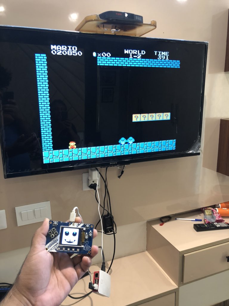 iAyanPahwa's tweet photo. Playing NES on bigger screen now using @RetroPieProject running on @Raspberry_Pi and @adafruit PyBadge as game controller running @CircuitPython HID keyboard program ❤️ https://t.co/LqLO3eK8gG