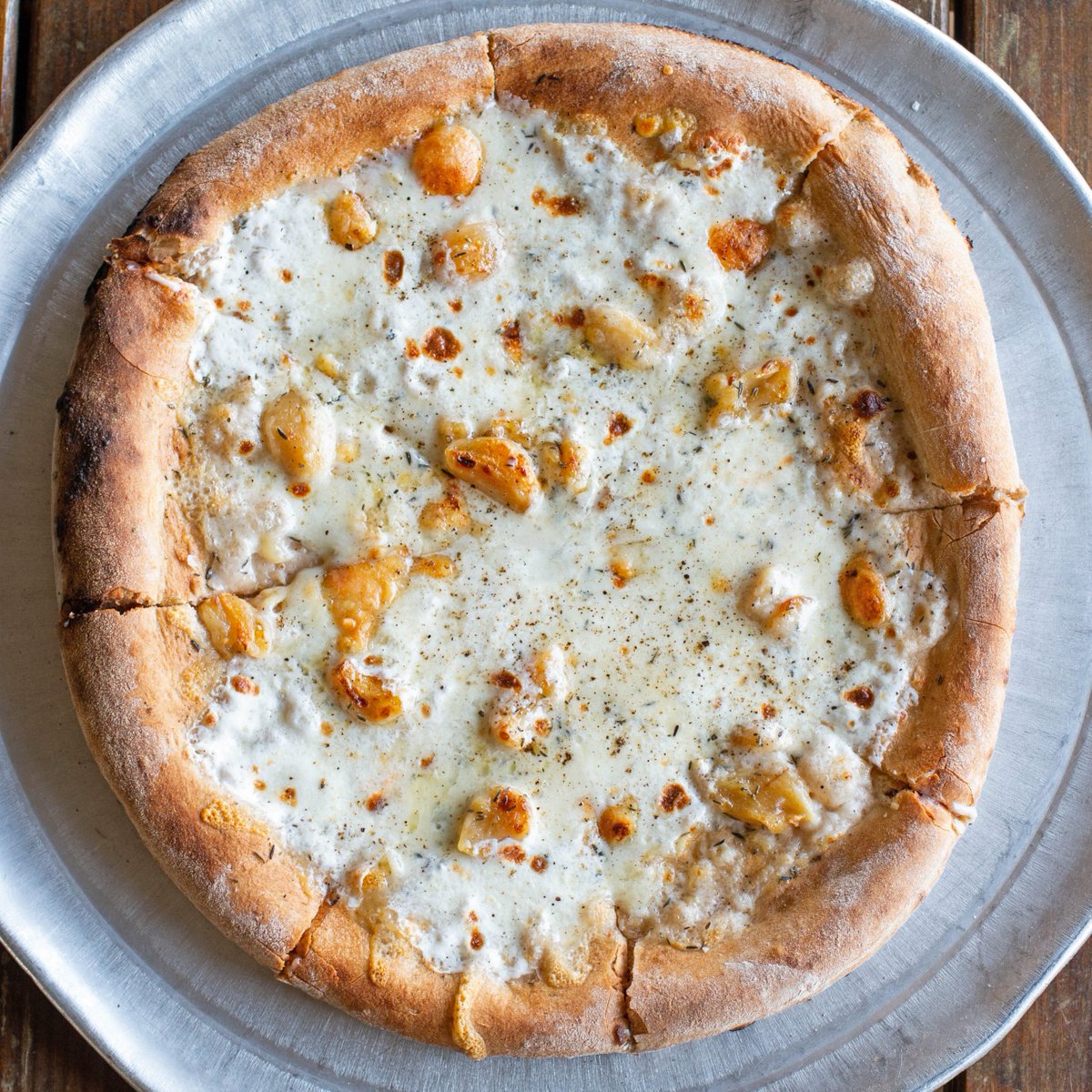 jesterkingbeer's tweet photo. The Bianca pizza from Jester King Kitchen -- white sauce, fontina, taleggio, mozzarella, thyme, garlic confit, lemon
We're open for contactless curbside pickup 7 days a week from 12-8pm. Order online (https://t.co/iv2dko3BTU) or call 512-661-8736
#jesterking #jesterkingkitchen https://t.co/zJEAvm8WAR