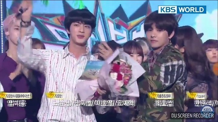 Aww he is a sweetheart... He was helping Jin to speak by holding the mic