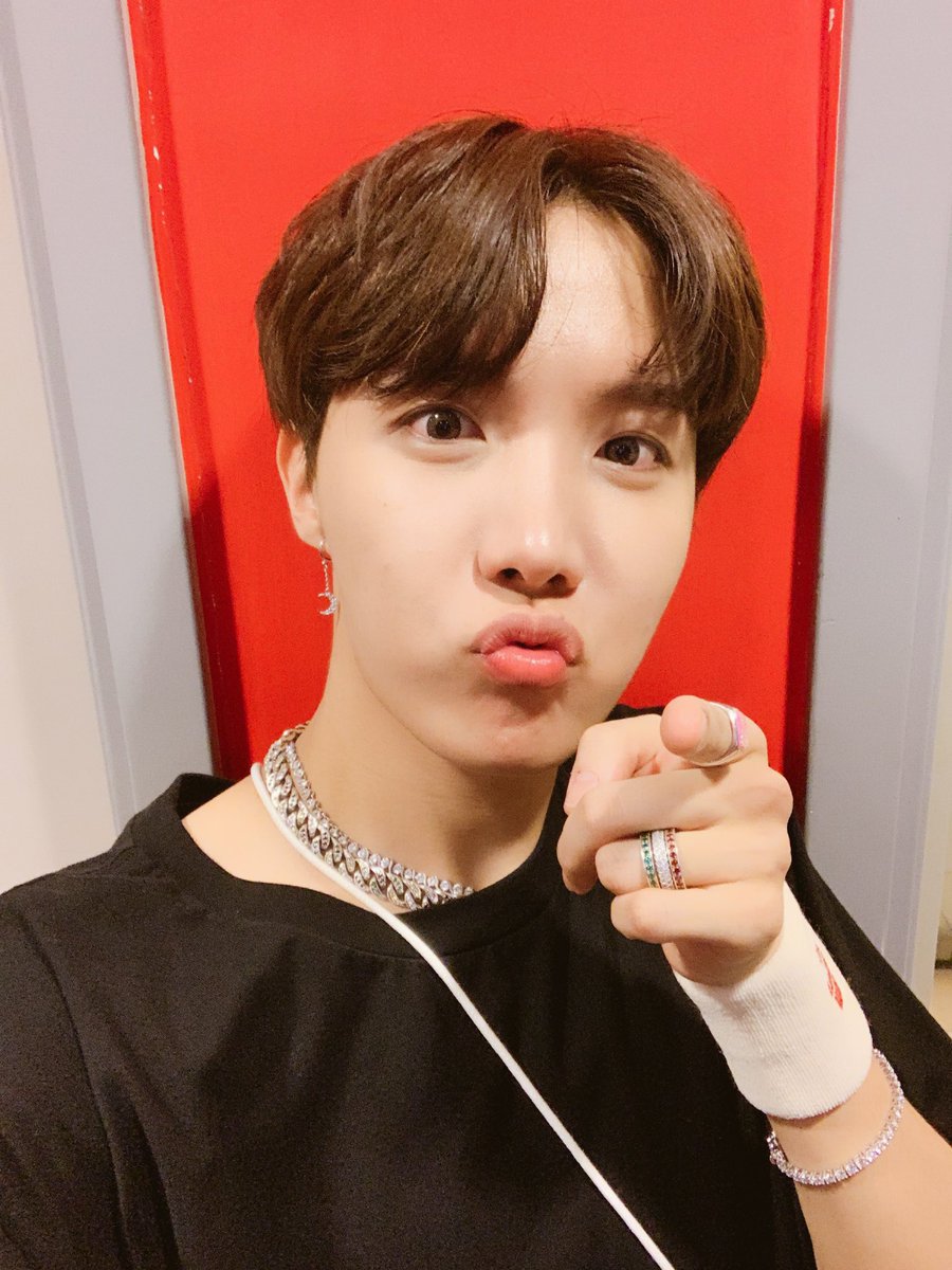 this looks like he is telling u to love urself and also just like look at his lil earring and all his fancy jewelry wow incredible