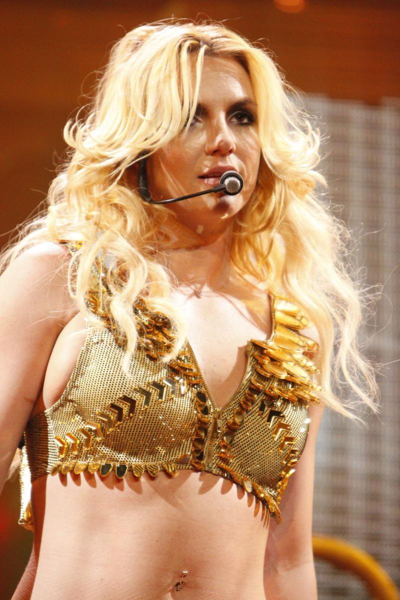 Britney on stage of the “Femme Fatale” Tour performing “Gimme More”.